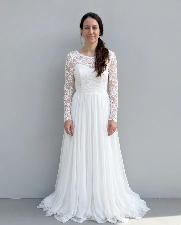 The same woman in a white lace wedding dress with a long skirt