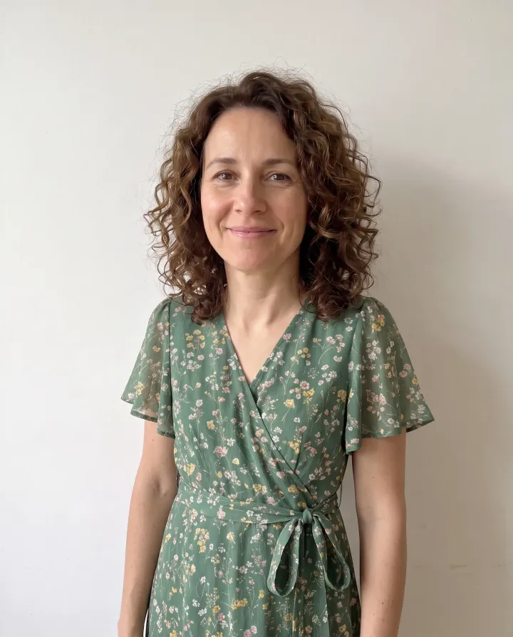 The same woman wearing the floral dress from the product photo