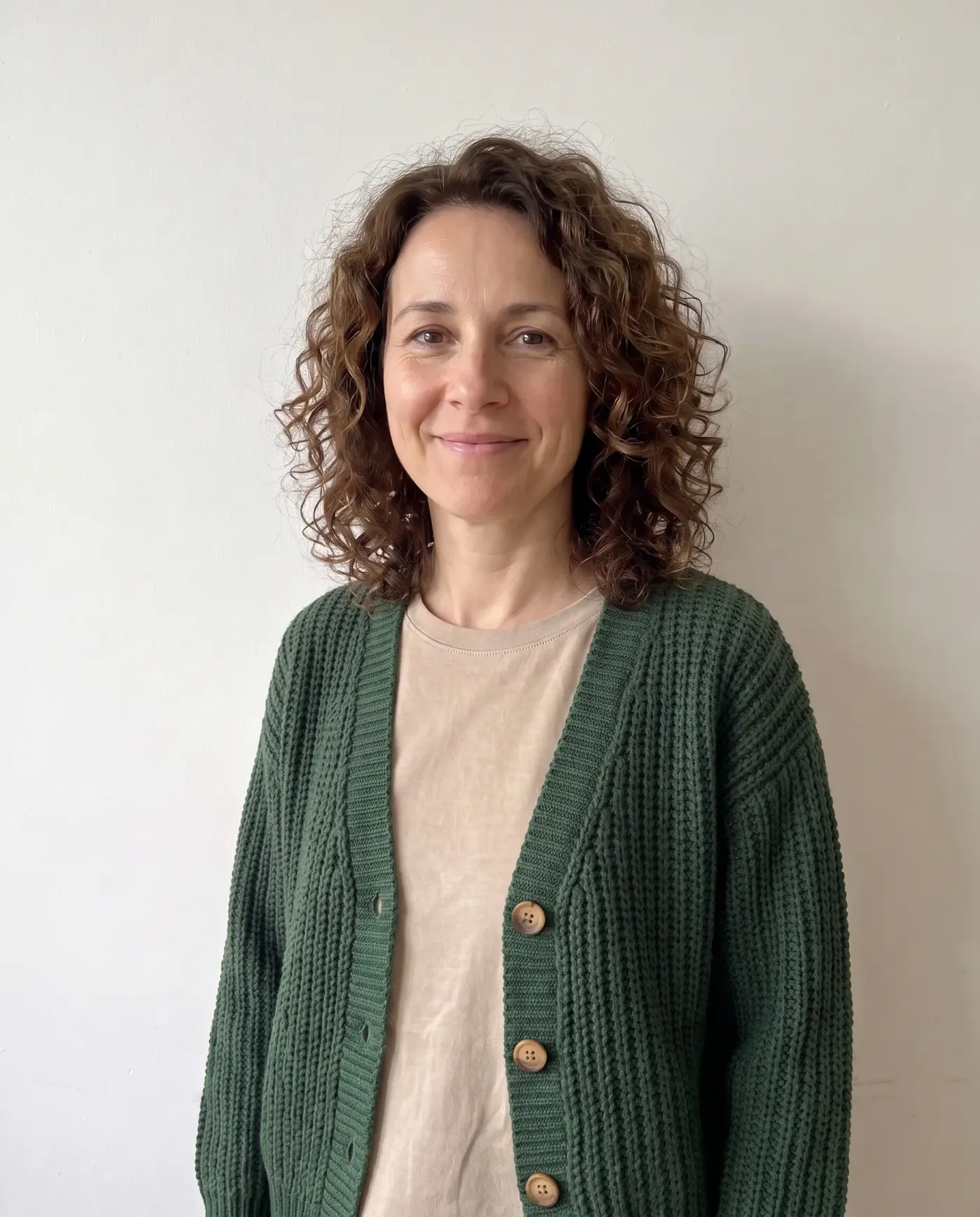 The woman wearing the green cardigan, used for the close-ups