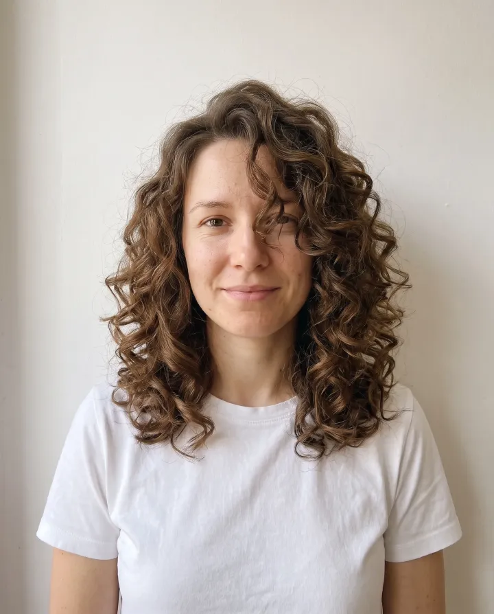 The woman with big, voluminous curls